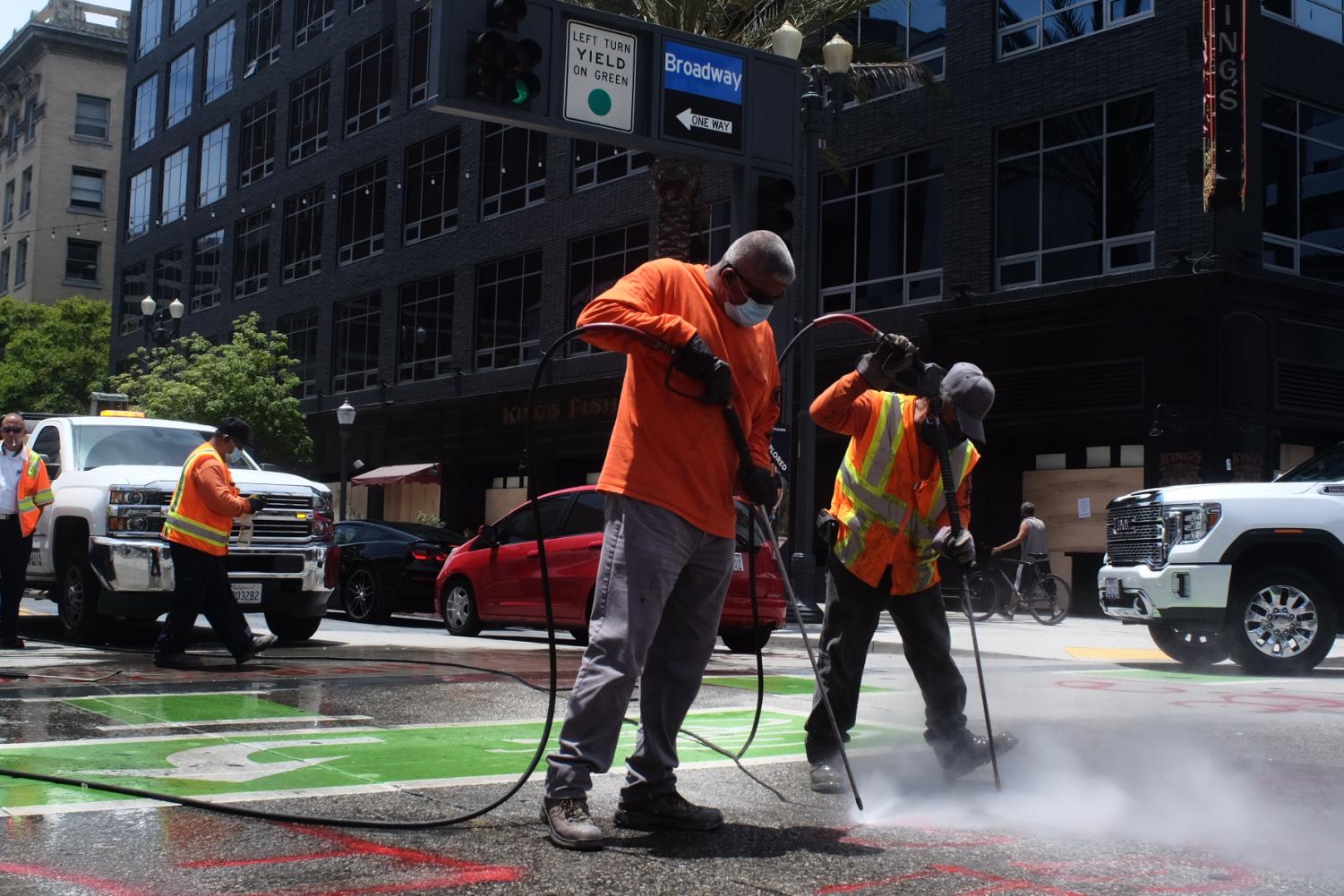 Volunteers Clean-up Downtown Long Beach After Riots