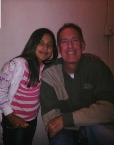 A young girl with man smiling